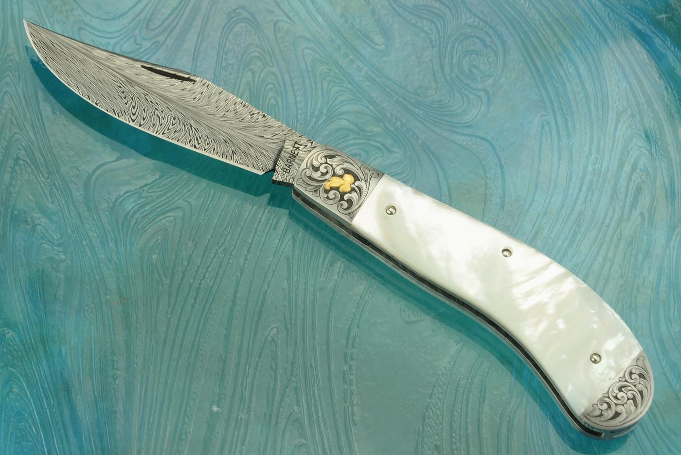 Feather Damascus Engraved Saddlehorn with Whitelip Mother of Pearl