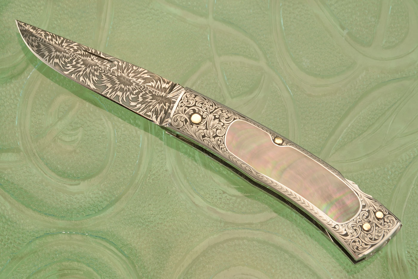 Engraved Backlock Interframe with Blacklip Mother of Pearl