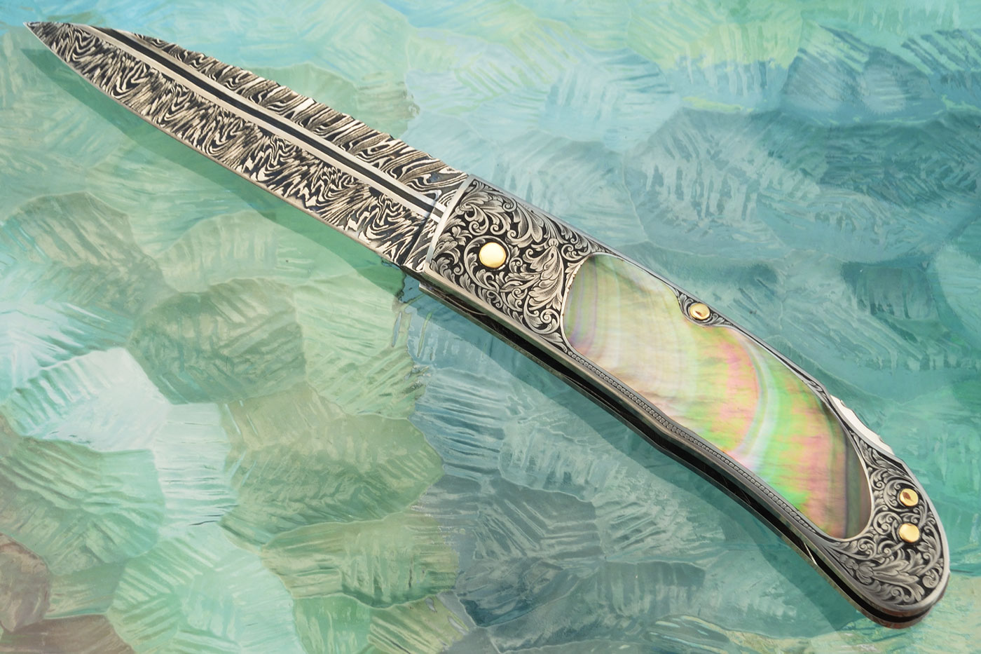 Engraved Backlock Interframe with Blacklip Mother of Pearl