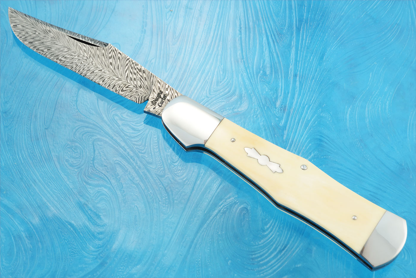 Feather Damascus Coke Bottle Slipjoint with Mammoth Ivory