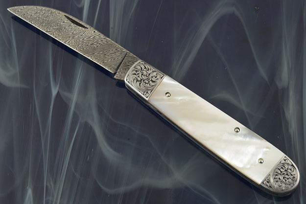 Engraved Wharncliffe Folder with Damascus and White Lip Mother of Pearl